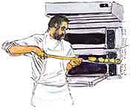 Pierre Koffman at the oven