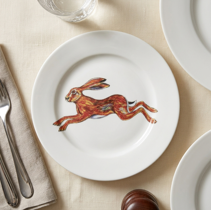 Hare leaping 19cm Flat Rimmed Plate styled on the table