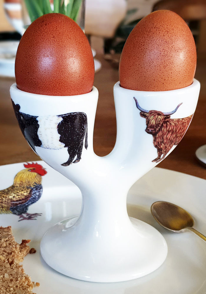 Cow Double Egg Cup in use