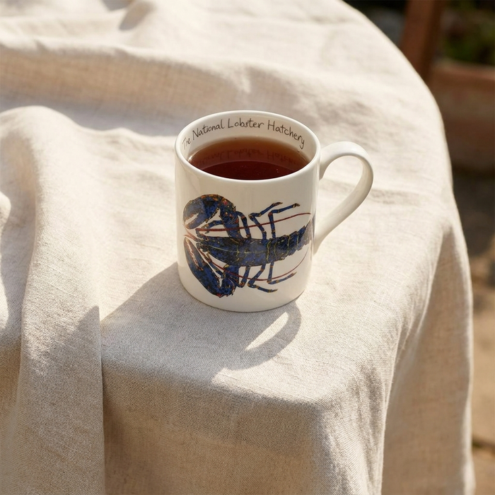 Blue Lobster National Lobster Hatchery Mug (large size) styled on the table