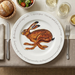 Hare Running 30cm flat rimmed plate lifestyle image