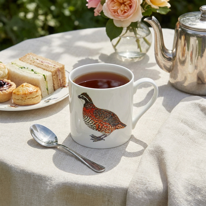 Bobwhite Quail Mug (large size) end of line by Richard Bramble styled on the table
