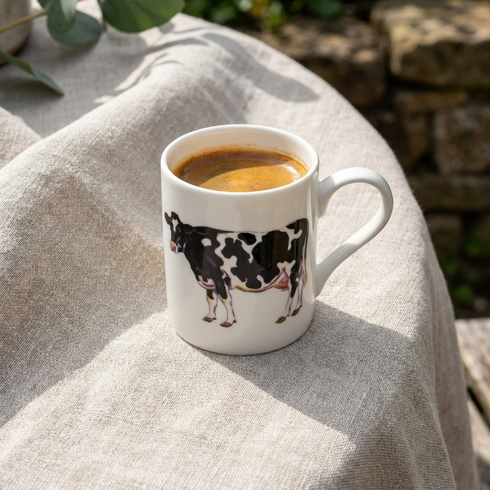 Holstein-Friesian Cow Small Mug styled on the table