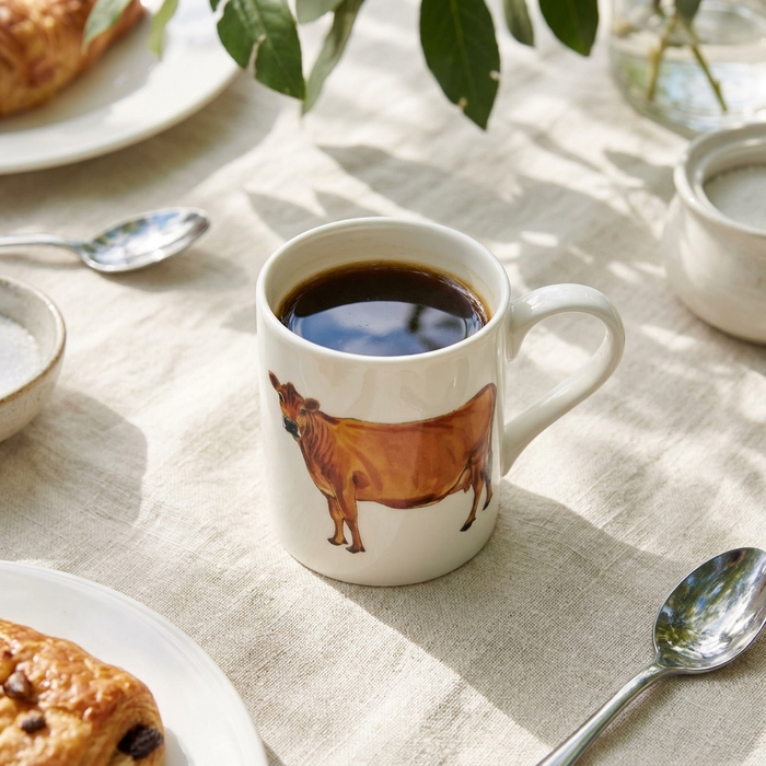Jersey Cow Small Mug styled on the table