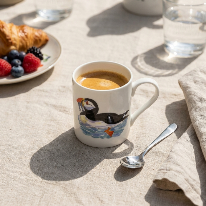 Puffins Small Mug styled on the table
