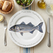 Striped Bass 30cm flat rimmed plate lifestyle image