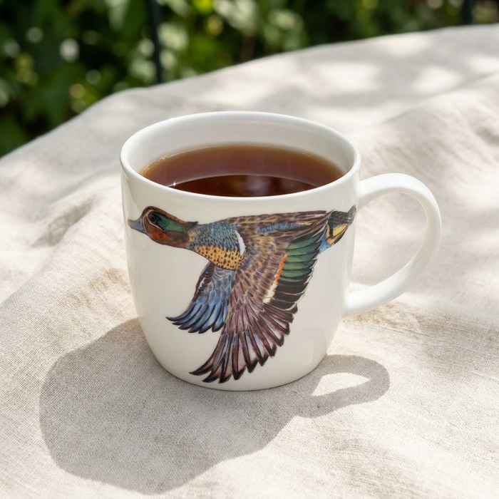 Teal Duck Mug (medium round sided) styled on the table