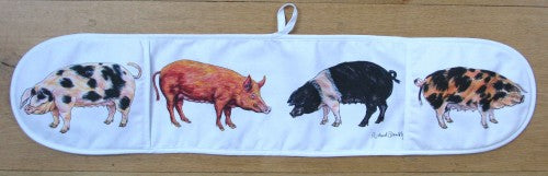 Pigs Cotton Oven Gloves styled on the table