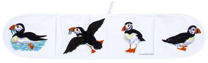 Puffin Cotton Oven Gloves styled on the table